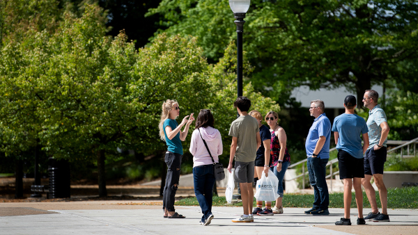 GVSU student tour guide showing future students around campus