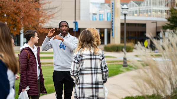 GVSU student tour guide showing future students around campus